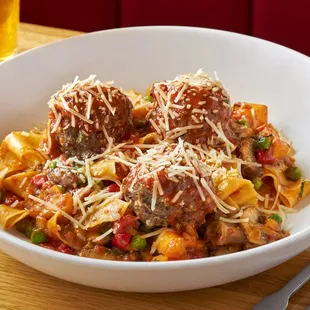 a bowl of pasta and meatballs