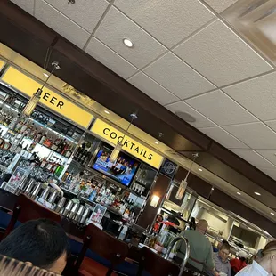 people sitting at tables in a restaurant
