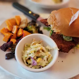 a plate of food with a sandwich and side dish