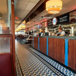 a view of a restaurant with a checkered floor