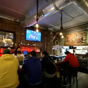 people sitting at the bar