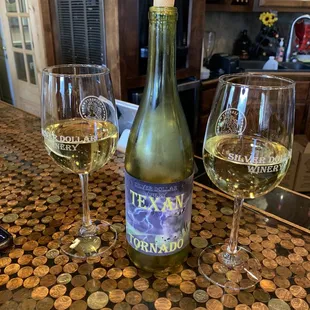 a bottle of wine and two glasses of wine