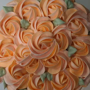 a close up of a rose cake
