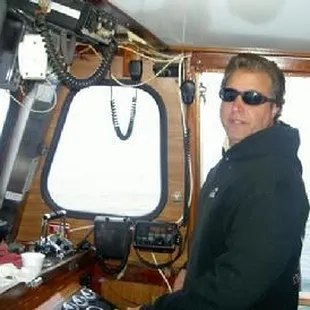Captain Chris Duba in the pilothouse