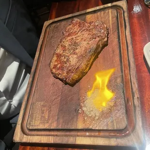Steak served with a flame of fire