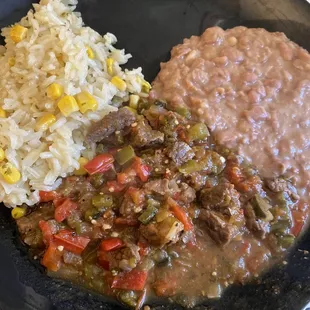 Steak chicana, with cilantro lime rice, and refried beans.