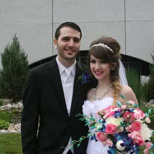 Lovely waterfall makes a perfect backdrop for the bride and groom.