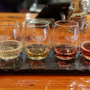 four glasses of wine on a tray