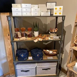 a shelf with baskets and food