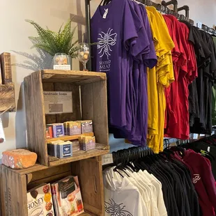 a variety of t - shirts on display