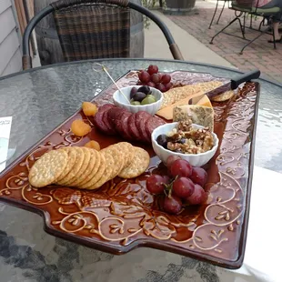 Cheese chocolate walnuts grapes sausage olive platter DELICIOUS