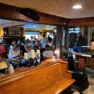 people sitting at tables in a restaurant