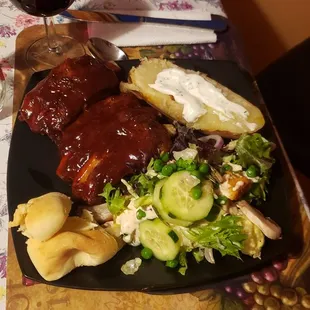Ribs, salad. Baked potato carryout. It was delicious!! Ribs fell off the bones.