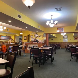 a restaurant with tables and chairs