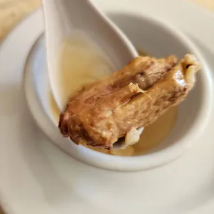 a spoon in a bowl of food