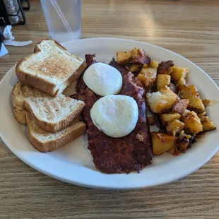 Corned beef hash with poached eggs and hash browns