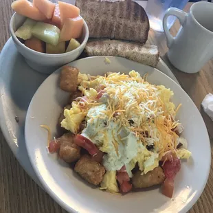 Tater tot skillet with a side of fruit