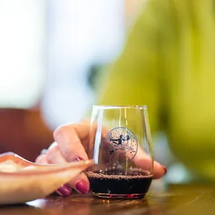 a woman holding a glass of wine