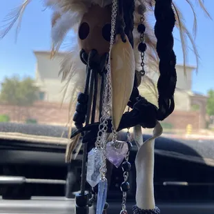 3 stone necklace on rear view mirror
