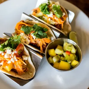 Fried Catfish Tacos w/ garlic chili sauce, pickled carrots, cilantro, mango salsa