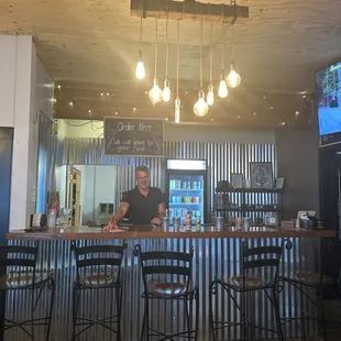 two men sitting at a bar