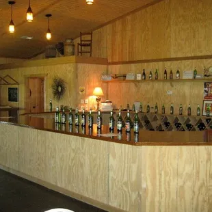 a bar with bottles of wine on it