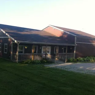 a brown building with a brown roof