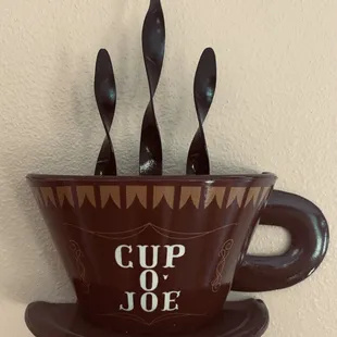 a cup of joe with spoons in it