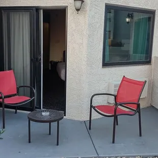 patio with red chairs