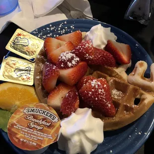 1 waffle with whipped cream and strawberries