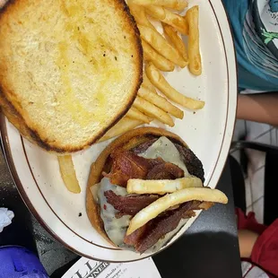 a grilled cheeseburger and fries