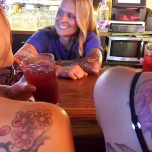 two women sitting at a bar