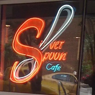 a neon sign in the window