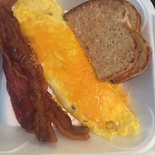 Steak omelette with hash-browns and extra bacon