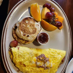 an omelet and fruit on a plate