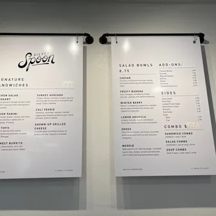 two menus hanging on a wall