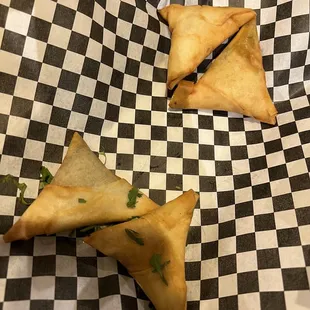two pieces of food on checkered paper