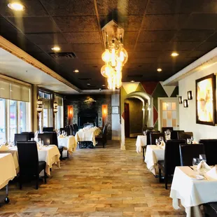 a dining room with tables and chairs