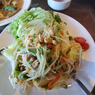 Papaya salad..fresh, spicy, perfect blend of sour, sweet, salt and spice. Chewy with crunch from nuts and green beans.