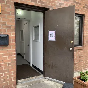 the entrance to a brick building