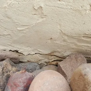 Contractor tried to cover gap between deck and dirt with concrete, now it is cracking and shifting