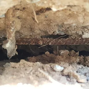 Exposed rebar, space beneath deck, sinking soil