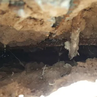 Space under deck, exposed rebar, sinking dirt