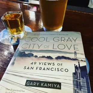 a book and a glass of beer