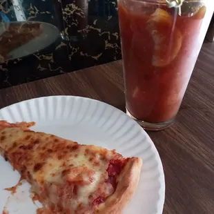 a slice of pizza and a drink