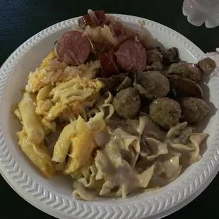 Sauerkraut with kielbasa's, beef stroganoff, baked Mac and cheese.