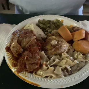 Stuffed cabbage, beef stroganoff, chicken, green beans, mashed potatoes, yams, and ham.
