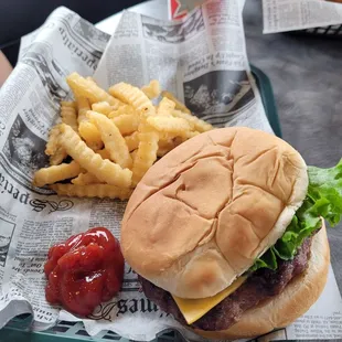 a hamburger and french fries on a tray