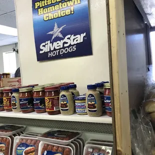 a display of sausages and hot dogs