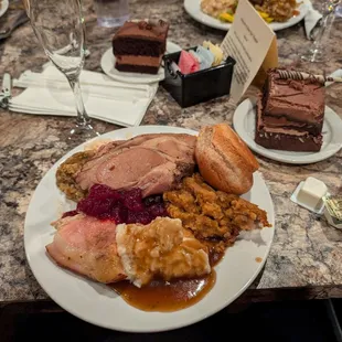 Dinner buffet had turkey, ham, roast beef, stuffing cranberry sauce.  Chocolate cake was already on the table
